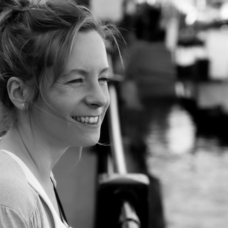 Kaveri Mehta, Lead Design Curator at TableTrailBeacon, reviewing corporate floral arrangements